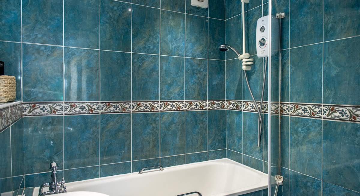 The bathroom with fitted shower.