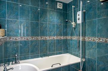 The bathroom with fitted shower.