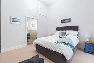 Bedroom two on the second floor is home to this fabulous king-size bed, en suite shower-room, and balcony with sea views.