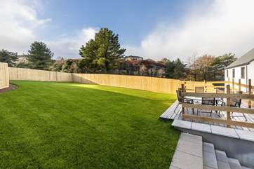 Fully enclosed garden and decked area. Perfect for playing, sunbathing, or simply relaxing in.