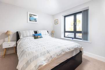 Bedroom one is on the ground floor and offers a king-size bed and en suite shower-room.