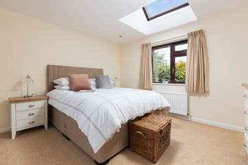 The main bedroom is home to this king-size bed.