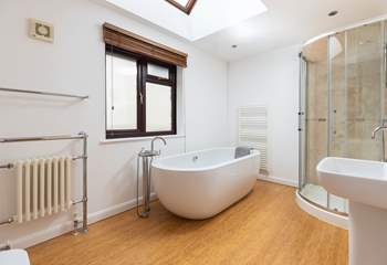 The glorious en suite bathroom features this fabulous roll-top bath.