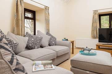The sitting-room offers such a comfy place to cuddle up and relax in after a full day of adventure.