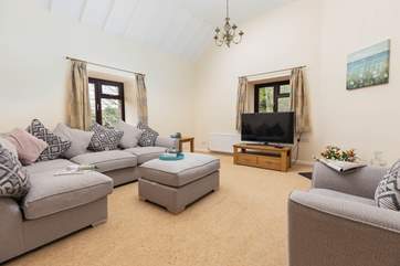The sitting-room is spacious and inviting.