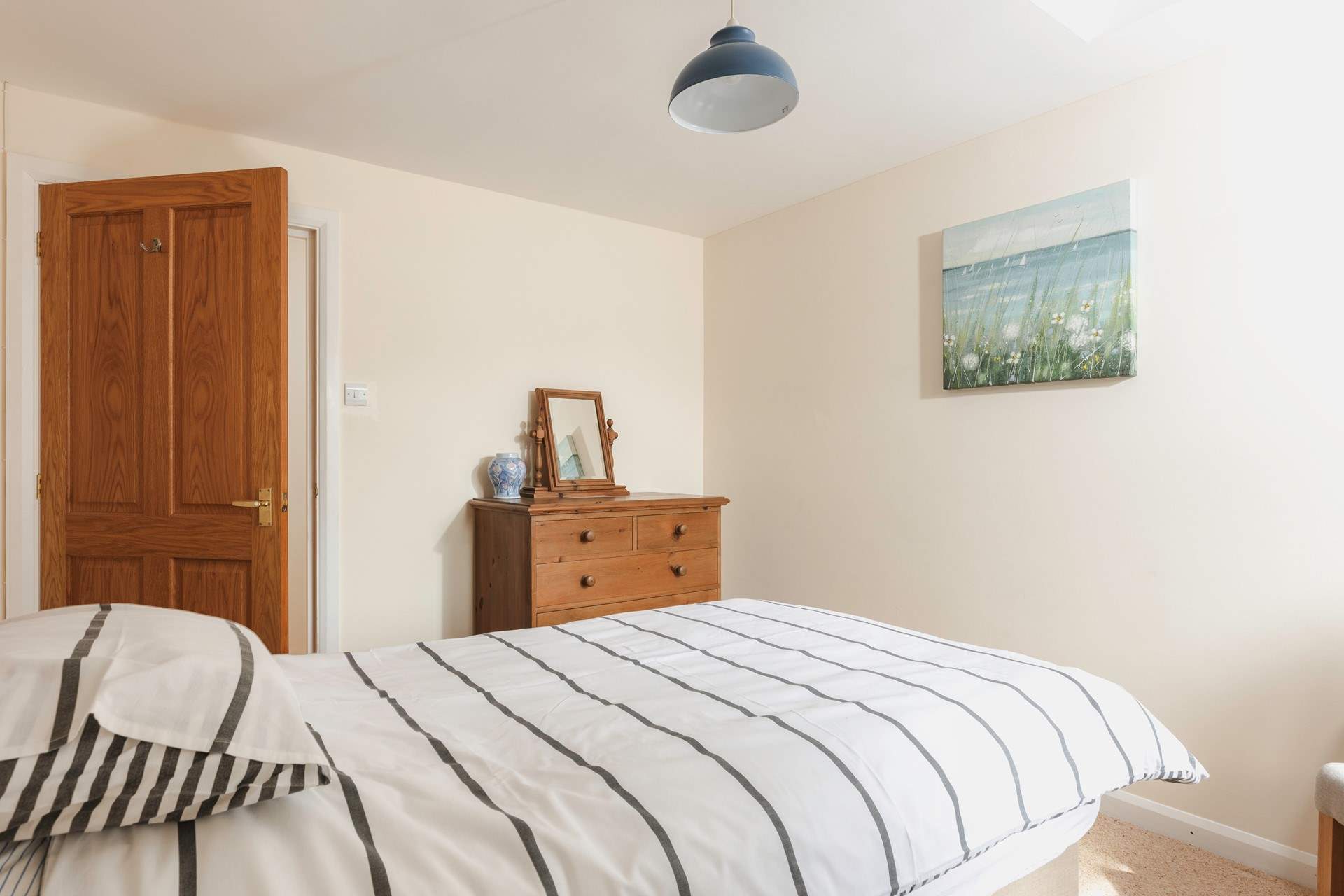 The single bedroom is light and airy.