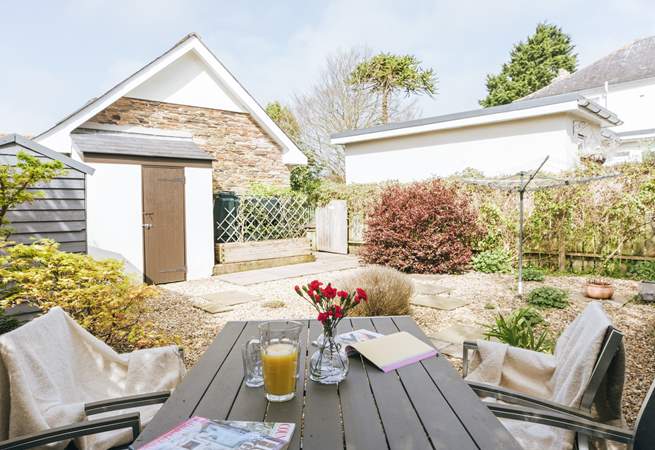The fully enclosed garden offers a lovely space to enjoy a touch of dining al fresco or a good book.