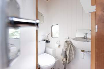 The toilet is tucked away within the horse box, so there's no need to put on your wellies in the night!