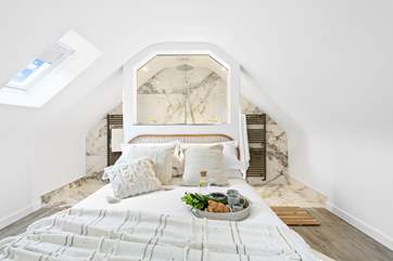 Bedroom three on the first floor is another King-size bed with a shower.