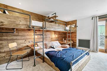 Bedroom one has a king-size bed and twin captain's bunks.