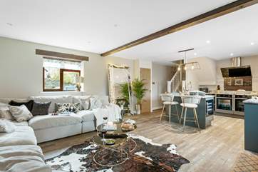 The tastefully decorated sitting-area and kitchen.
