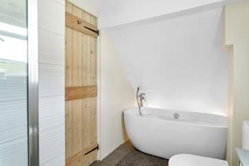 The family bathroom has a fabulous free-standing bath for a long soak after a busy day.
