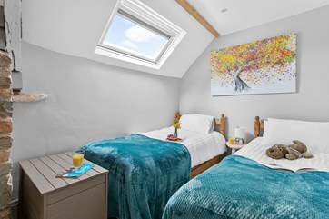 The twin bedroom is light and bright, perfect for either children or adults.