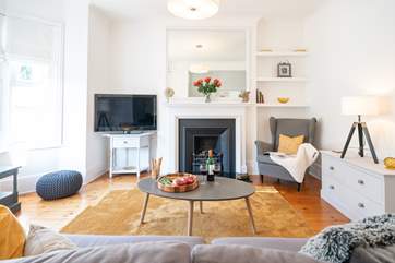 The light and airy sitting-room is a lovely place to relax.