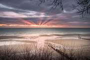 Wake up early to watch the sun rise overlooking Shanklin beach.