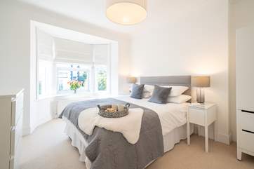 The dreamy main double bedroom has plenty of storage space.