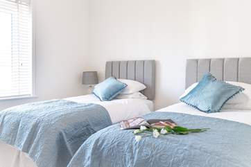 Oh so pretty, the twin room is decorated in lovely pastel shades.
