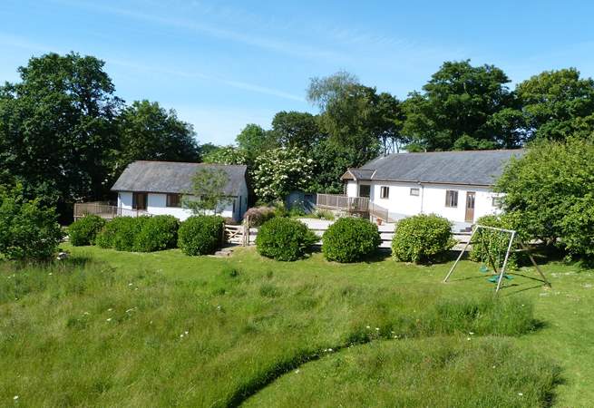 Orchard Cottage is the property on the right, enjoy playing in the meadow or swing set which is shared with Bramley Cottage. 