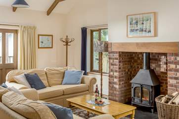 What a lovely cosy sitting area, enjoy snuggling up in front of the fire.