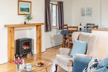 Enjoy the warmth of the electric wood-burner in the cooler months.