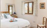 The main bedroom enjoys views over the fields, with only the sound of bird song to hear.  - Thumbnail Image