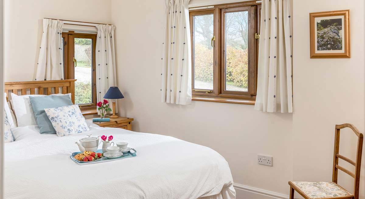 The main bedroom enjoys views over the fields, with only the sound of bird song to hear. 