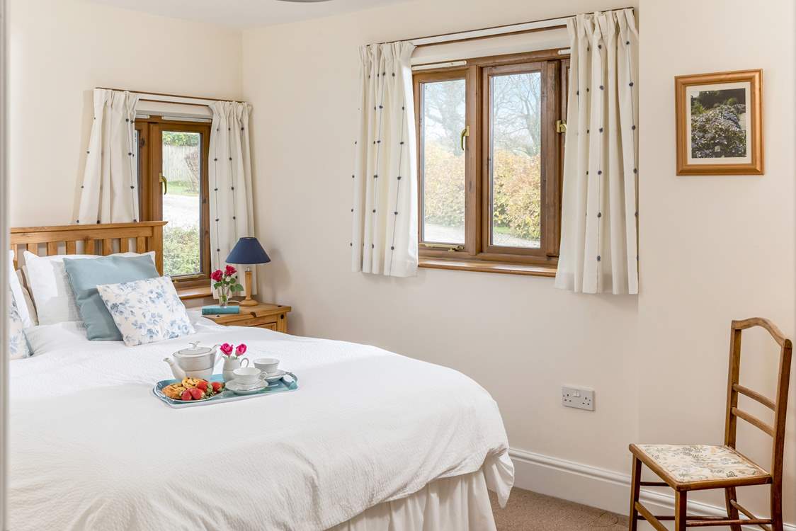 The main bedroom enjoys views over the fields, with only the sound of bird song to hear.