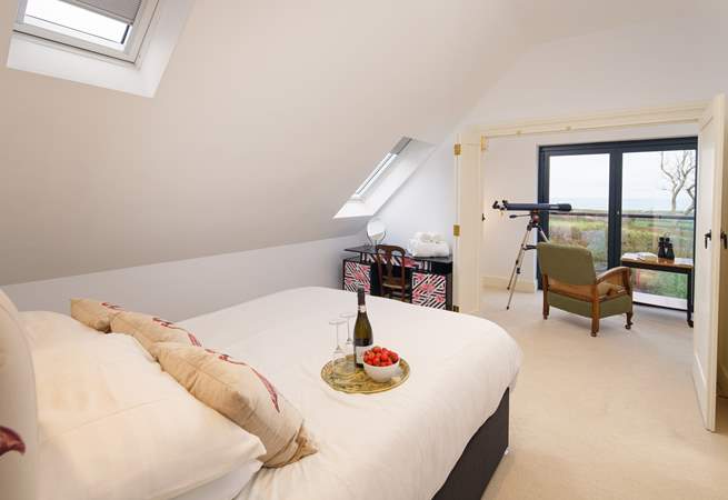 Bedroom four has a king size bed, en suite shower-room and magnificent views across the coastline out to sea.