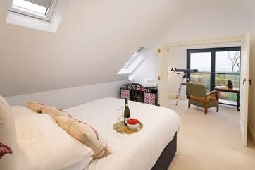 Bedroom four has a double bed, en suite shower-room and leads to the reading-room.