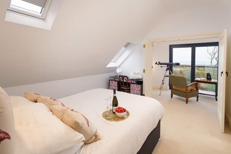 Bedroom four has a king size bed, en suite shower-room and magnificent views across the coastline out to sea.