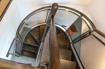 The amazing metal staircase leading up to the reading-room from the dining-area.