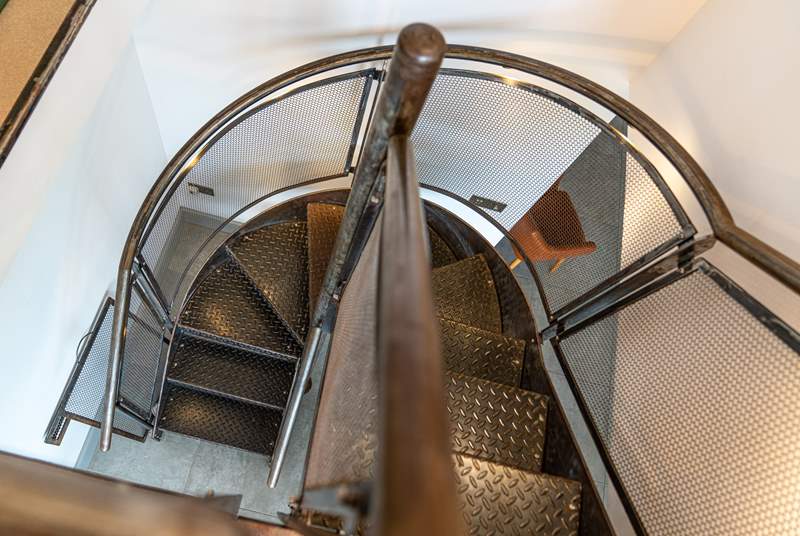 Climb the amazing  bespoke metal staircase leading up to the spectacular views from the  reading-room leading into the superb master bedroom.