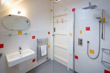 The en suite wet-room for bedroom four has a waterfall shower.