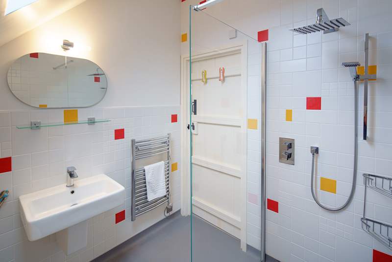 The bright en suite wet-room for the master bedroom. Enjoy the hot and soothing waterfall shower.