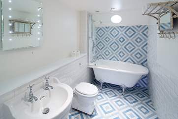 The family bathroom on the first floor has a wonderful bath and overhead shower.