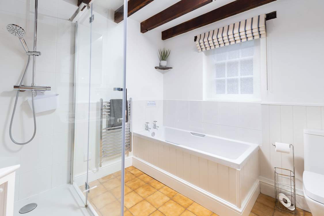 The family bathroom has a bath for a welcome soak and a shower.