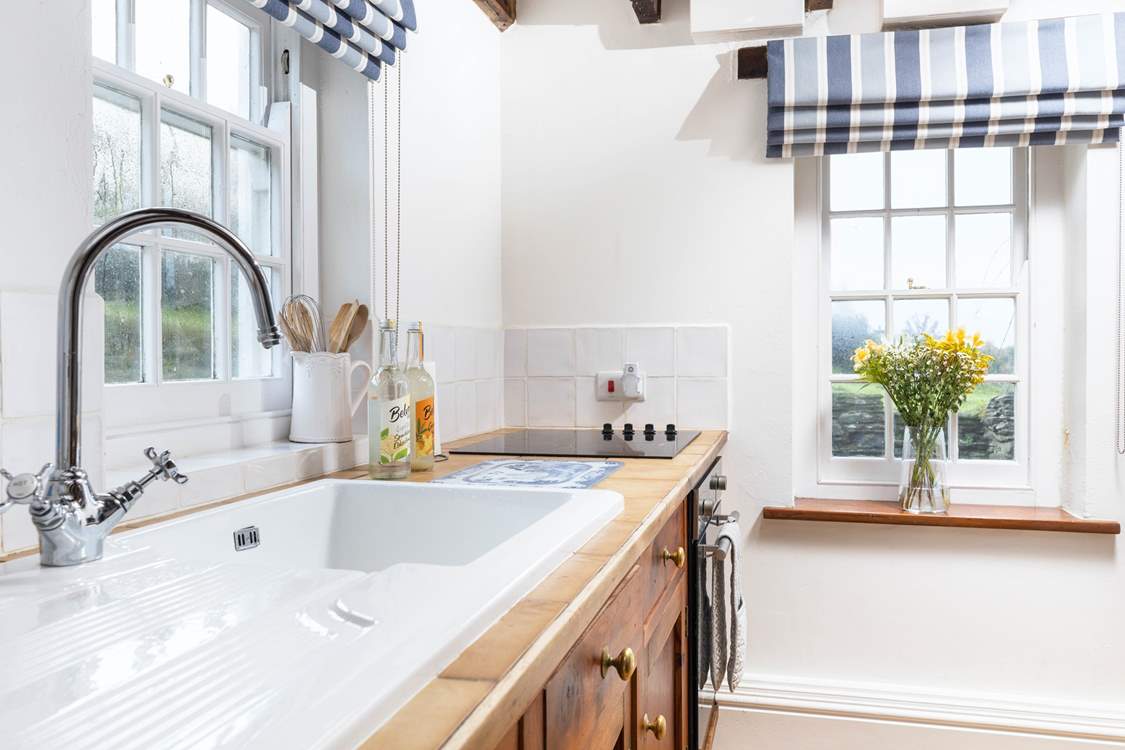 Light floods into the kitchen through the dual-aspect windows.