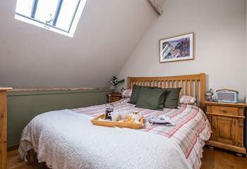 The main bedroom with a comfortable king-size double bed.