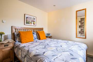 The bedroom has a comfy king-size bed.