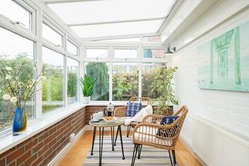 The conservatory is the perfect place to sit back and relax with a good book while overlooking the pretty garden.