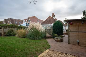 The cottage showcases a lovely well maintained large garden.
