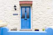 The blue front door welcomes you to Swn Y Mor.