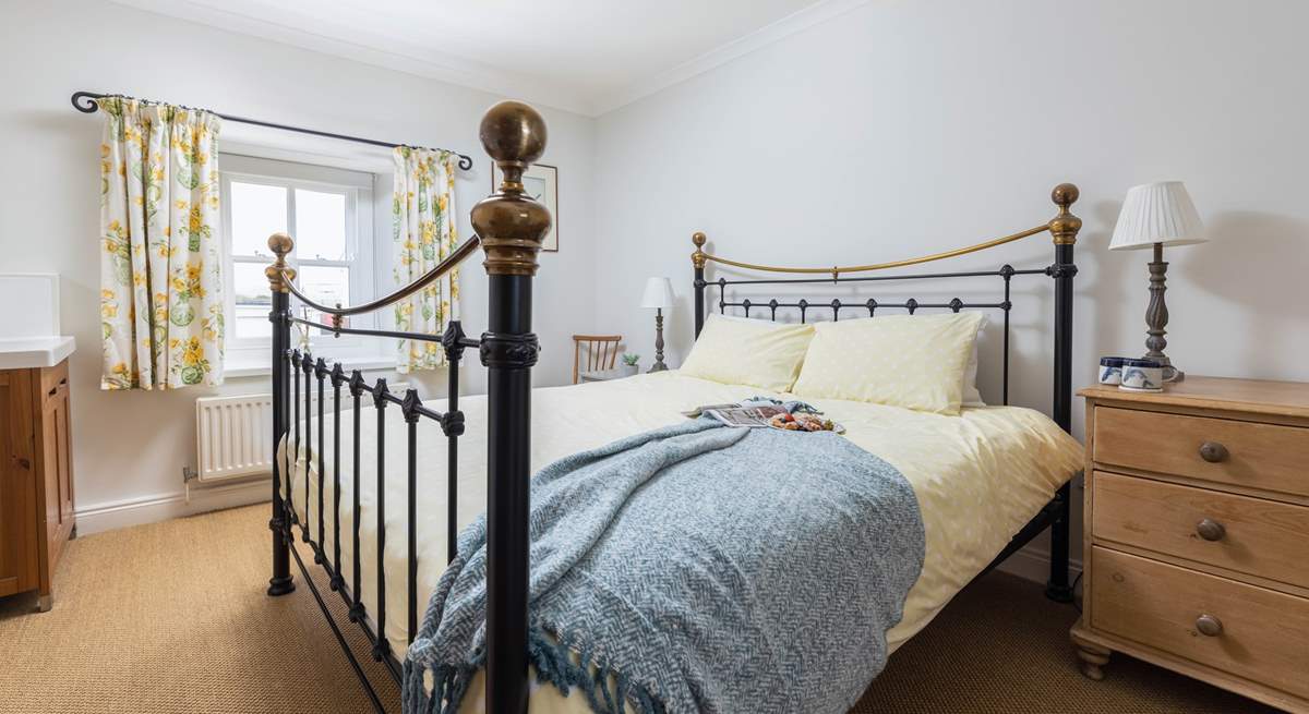 The main bedroom has a fabulous super-king size bed and a lovely brass bedstead. 