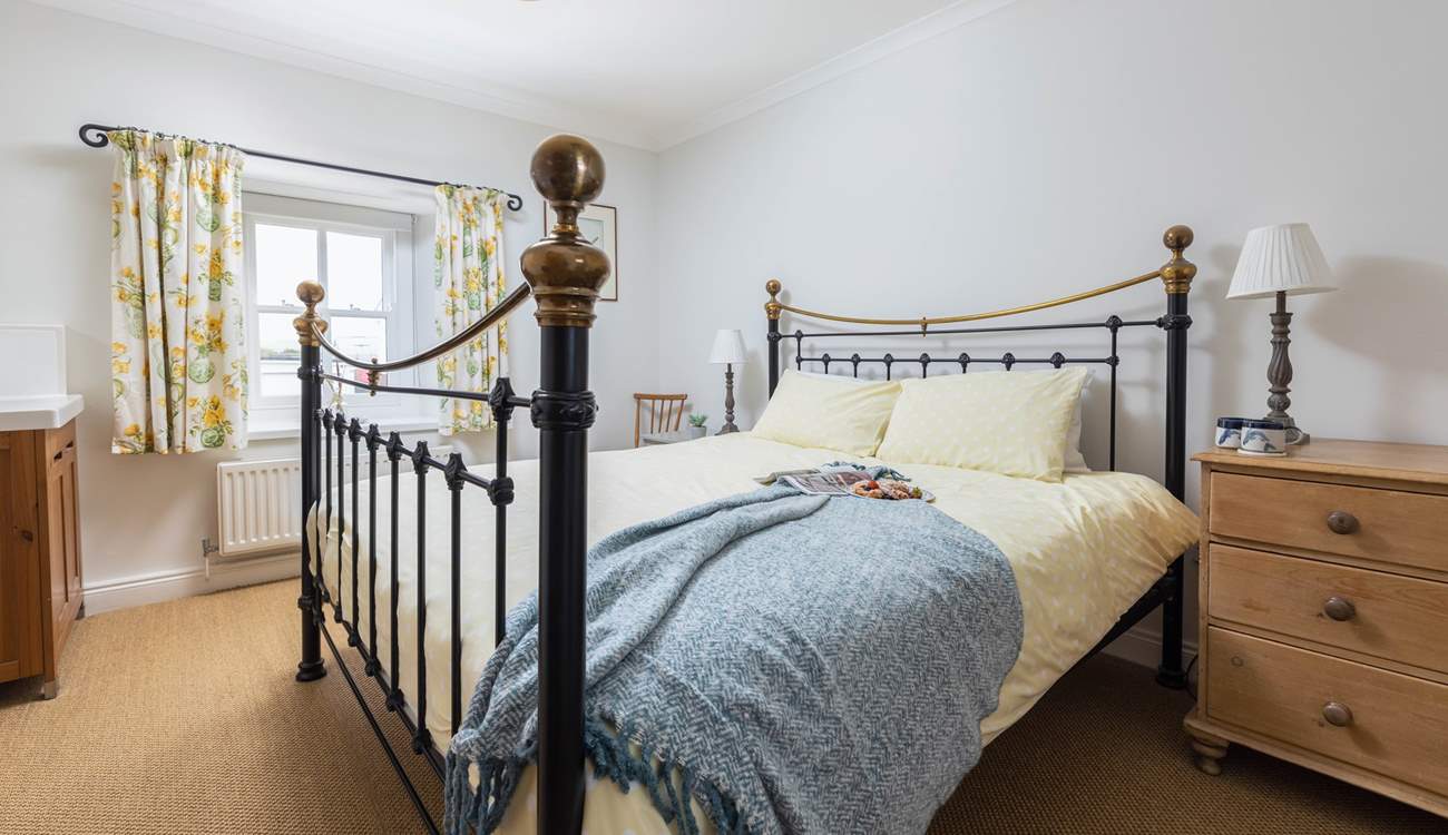 The main bedroom has a fabulous super-king size bed and a lovely brass bedstead. 