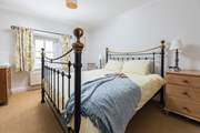 The main bedroom has a fabulous super-king size bed and a lovely brass bedstead.