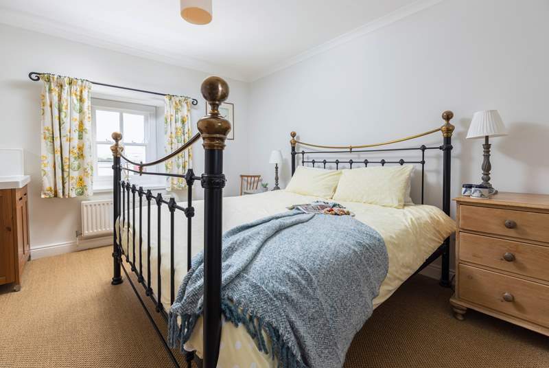The main bedroom has a fabulous super-king size bed and a lovely brass bedstead. 
