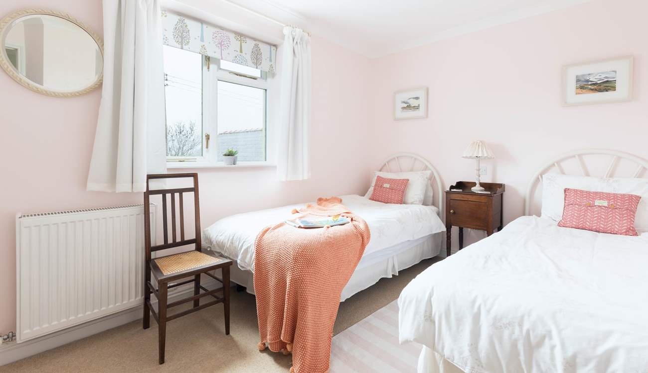 The lovely twin bedroom is suitable for either children or adults. 