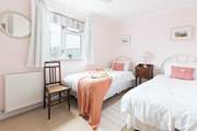 The lovely twin bedroom is suitable for either children or adults.