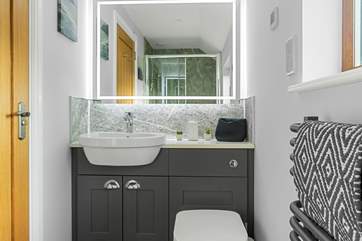 Beautifully crafted, the en suite shower-room is simply lovely.