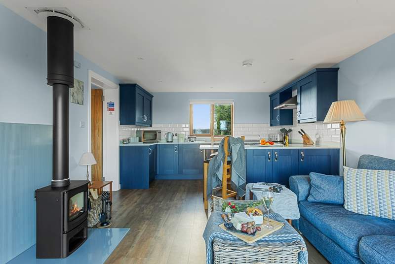 Beautifully decorated in blue hues, and there's a warming wood-burner.